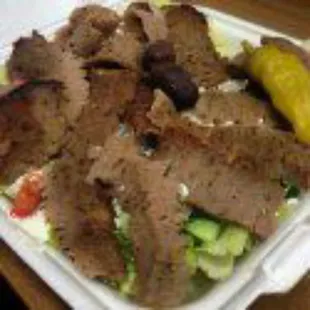 Gyro salad. Lamb on a Greek salad. Get excited for the freshest salad you will taste, not the gyro ;).