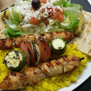 Chicken kabob plate with rice and salad