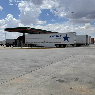 a truck parked at a gas station