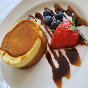 a dessert with a strawberry and chocolate sauce
