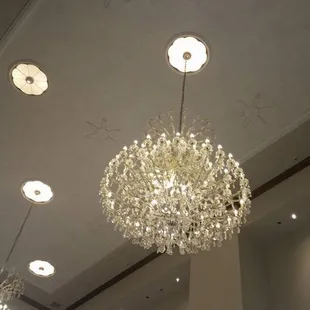 Lovely chandeliers adorn the ceilings