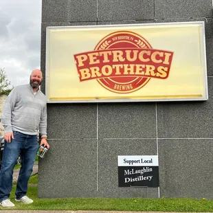 a man standing in front of a building