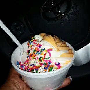 Favorite.. soft serve orange cream w/rainbow sprinkles on vanilla side