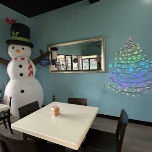 a snowman and a christmas tree