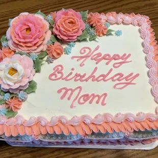 1/8 sheet Chocolate birthday cake with chocolate mousse and white buttercream frosting.