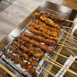 skewered meat on a grill