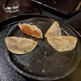  three dumplings on a plate