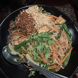  a plate of noodles and vegetables