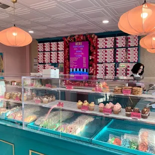 Case filled with desserts + the menu