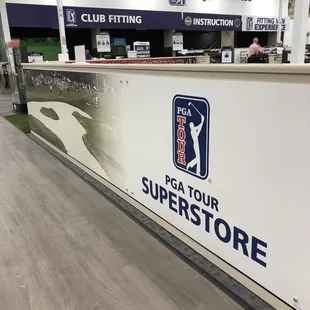 Wall surrounding the practice putting area.
