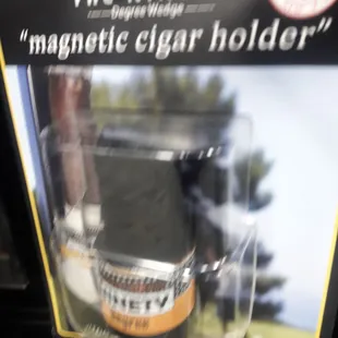 Something for the golfer to hold his cigar when it's his turn to hit the ball