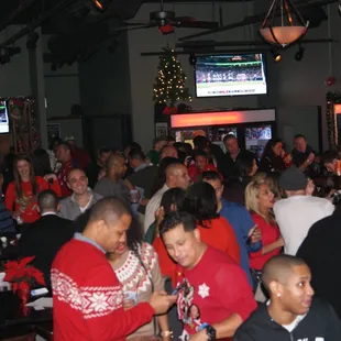  a large group of people at a bar