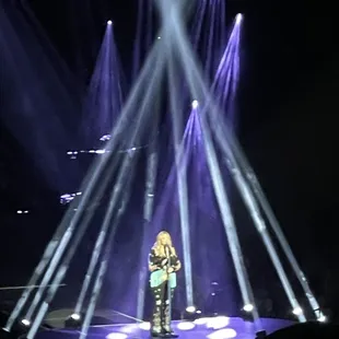 a woman standing on a stage