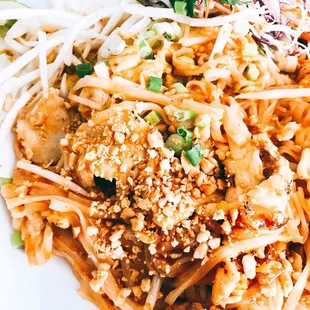 a plate of noodles with meat and vegetables