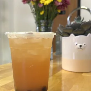 a cup of iced coffee on a table