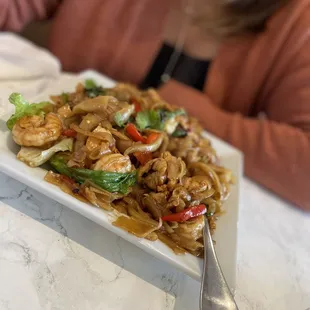 a plate of stir fried food