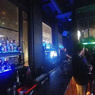 a crowd of people at a bar