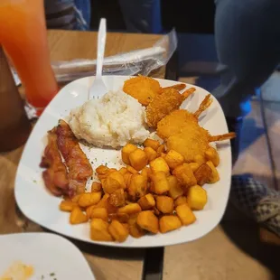 Shrimp and grits with bacon and hash browns