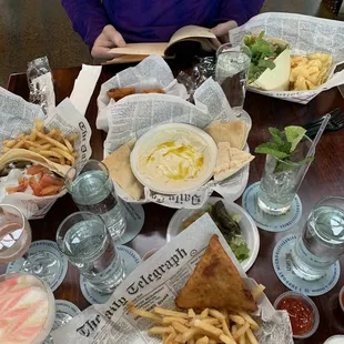 Veggie samosas, hummus, chicken gyro, grape leaves, and lamb gyro.