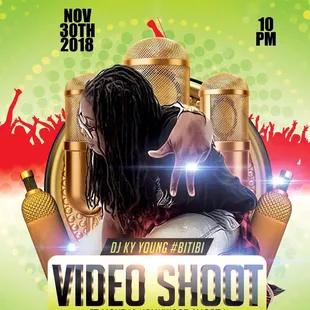 a man hugging a woman in front of microphones