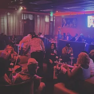 a group of people in a bar