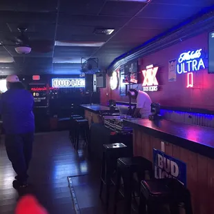 a bar with neon signs