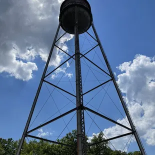 a water tower with a sky background