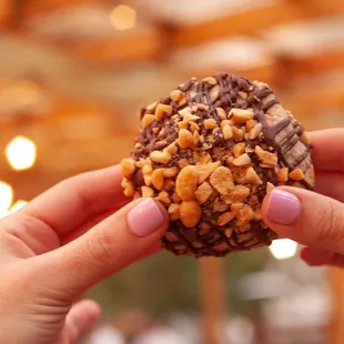 a person holding a donut