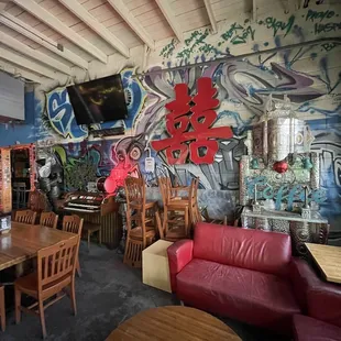 a restaurant with graffiti on the walls