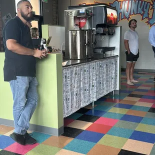 a man standing at a counter