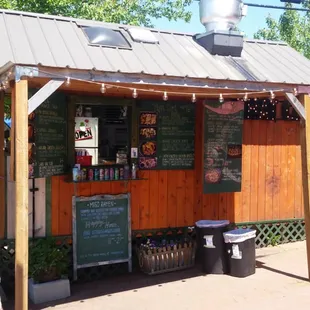 One of several food carts sharing a very pleasant seating area.