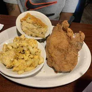 Two pieces of pork chops, Mac and cheese, hasbrown casserole, and a drink for $12. Come on!