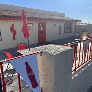 a coca cola sign on a fence