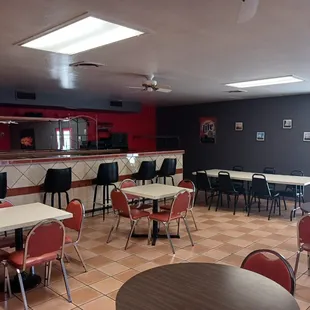 a restaurant with tables and chairs