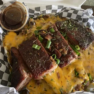 a plate of ribs and cheese