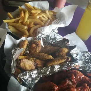 Fiery hot and lemon pepper wings with large fries.