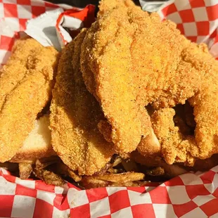 4 piece catfish fillet, bread, French fries, pickles, and pepper