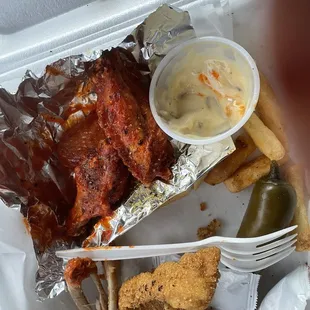 Spicy lemon pepper wings, and catfish, combo