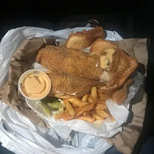 Fried Tilapias with fries and toast and I had already ate some of it. There where big pieces and All of this for only $9 and its amazing!