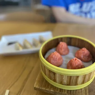 a person sitting at a table with chopsticks