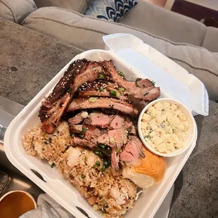 a tray of meat and rice