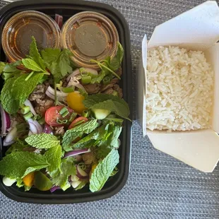 a lunch of rice, vegetables, and meat