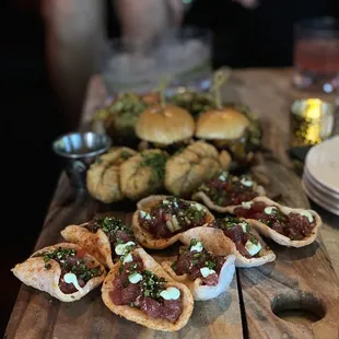 Tuna poke chips, empanadas, sliders, and avocado toast