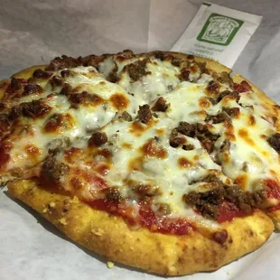 a pizza with meat and cheese