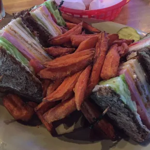Club sandwich with sweet potato fries