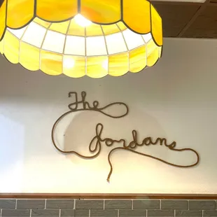 Lasso rope sign with the owner's name