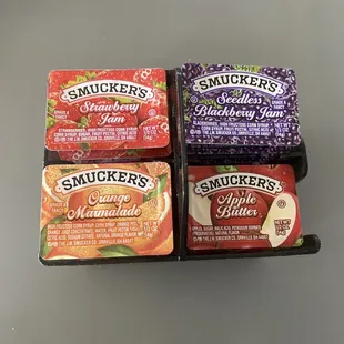 Selection of jams . Plus for orange marmalade and blackberry jams.