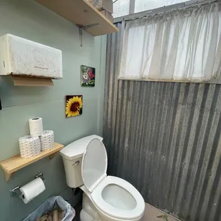 a toilet in a small bathroom