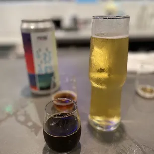 a glass of beer and a shot of soda