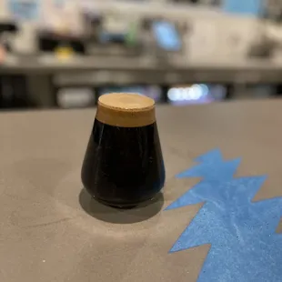 a glass of beer on a table